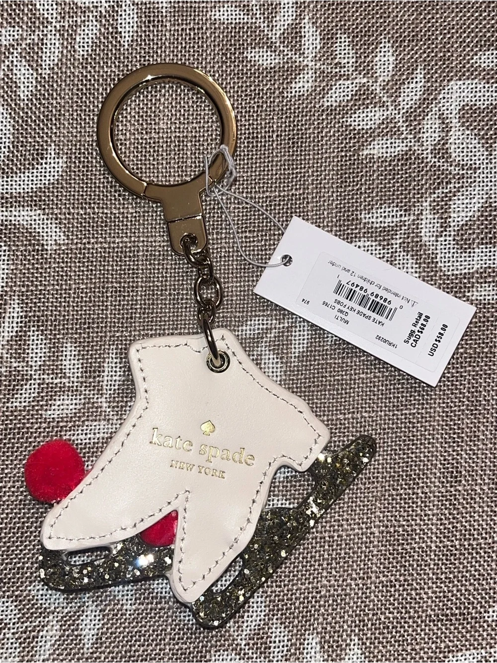 kate spade NWT! Ice skate key fob with red pom-poms